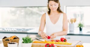 A woman preparing a meal.